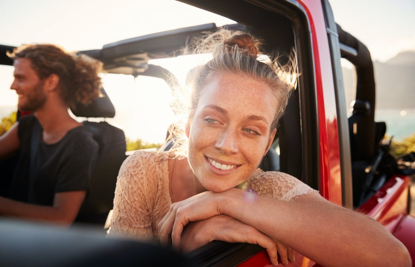 millennial-white-couple-on-a-road-trip-driving-in-open-top-car-women-leaning-on-car-door-close-up-picsk1yn47p7jtsp2ukpd9adq9wv1106oisls2b57s